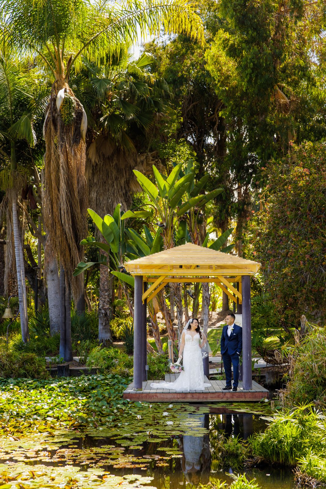 Kristina and Jose beneath a garden gazebo at Paradise Point Resort